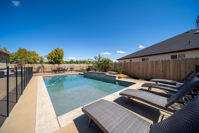 view of swimming pool with a fenced in pool, a patio area, and a fenced backyard