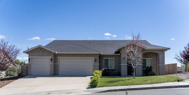 819 Bellagio Ter, Redding, CA 96003 - view of front of house with a garage, stucco siding, concrete driveway, and roof with shingles