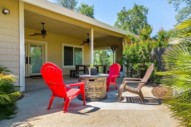 view of patio with fence and ceiling fan