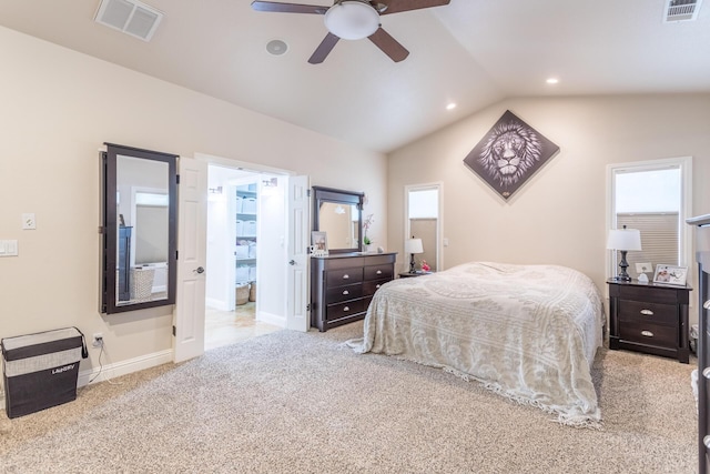 bedroom with multiple windows, visible vents, lofted ceiling, and carpet flooring