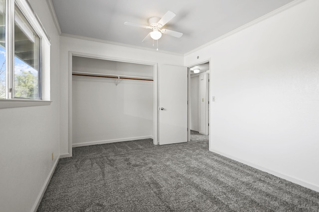 unfurnished bedroom with baseboards, a closet, carpet floors, and ornamental molding