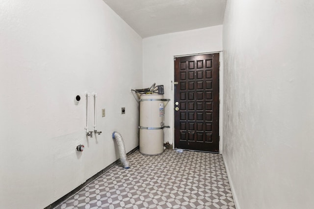 clothes washing area with tile patterned floors, laundry area, and hookup for an electric dryer