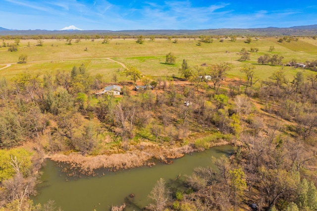 drone / aerial view featuring a mountain view and a rural view