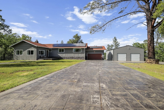 17622 China Gulch Dr, Anderson, CA 96007 - single story home featuring an outbuilding, driveway, solar panels, and a front lawn