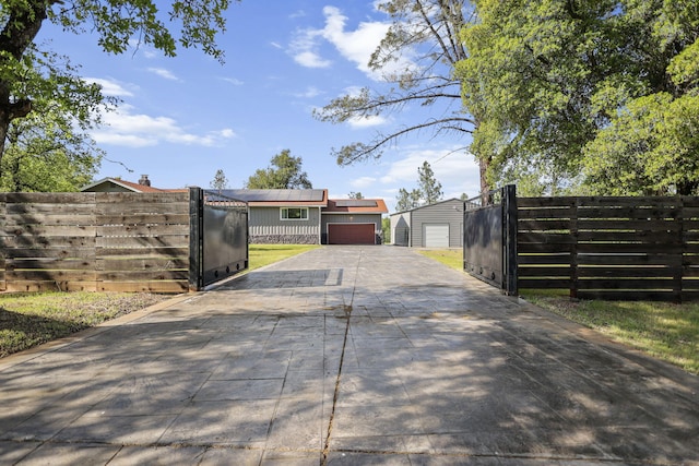 17622 China Gulch Dr, Anderson, CA 96007 - view of gate featuring an outbuilding and fence