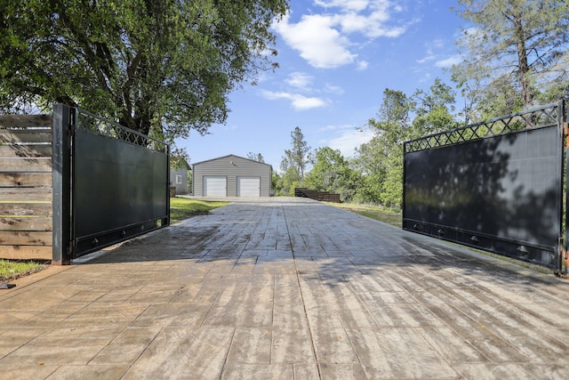 17622 China Gulch Dr, Anderson, CA 96007 - exterior space featuring a gate, a detached garage, and an outdoor structure