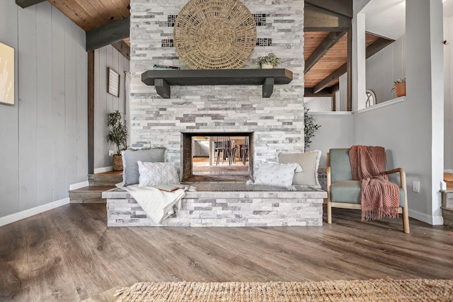 17622 China Gulch Dr, Anderson, CA 96007 - unfurnished room featuring wooden ceiling, wood finished floors, beamed ceiling, and a stone fireplace