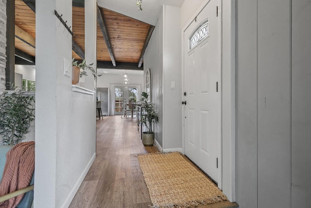 17622 China Gulch Dr, Anderson, CA 96007 - foyer entrance featuring wooden ceiling, baseboards, beamed ceiling, and wood finished floors