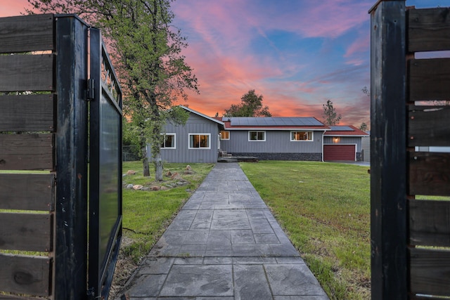 17622 China Gulch Dr, Anderson, CA 96007 - back of house with a lawn, solar panels, and a garage