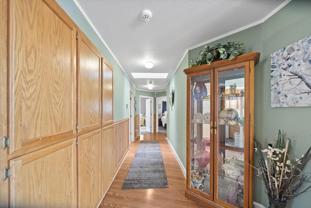 20371 Geo Ln, Lakehead, CA 96051 - hall with crown molding, light wood-style flooring, and a textured ceiling