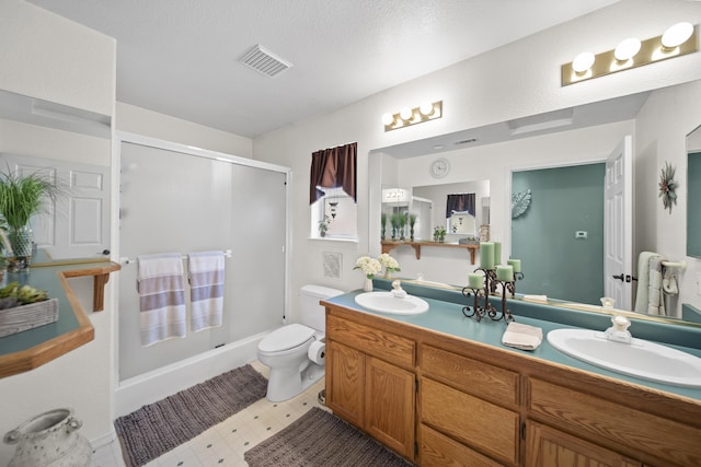 20371 Geo Ln, Lakehead, CA 96051 - bathroom featuring a stall shower, visible vents, toilet, and a sink