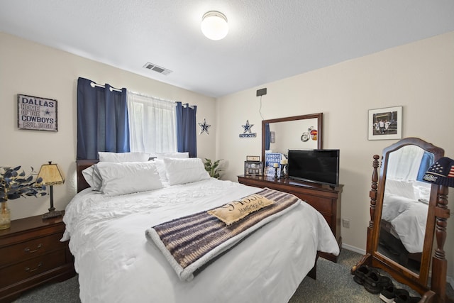 20371 Geo Ln, Lakehead, CA 96051 - bedroom with baseboards, visible vents, dark colored carpet, and a textured ceiling
