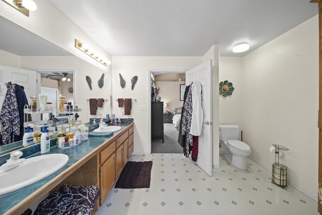 20371 Geo Ln, Lakehead, CA 96051 - ensuite bathroom with toilet, a sink, ceiling fan, double vanity, and ensuite bathroom