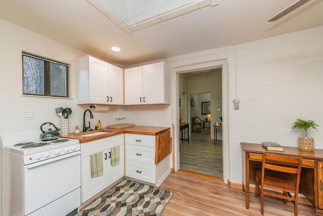 493 Main St, Weaverville, CA 96093 - kitchen featuring electric stove, white cabinets, light wood-style flooring, wooden counters, and recessed lighting