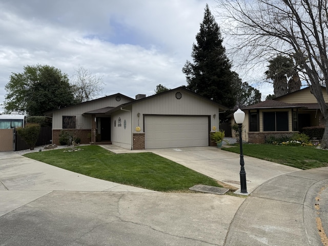 ranch-style home featuring brick siding, a front yard, driveway, and an attached garage
