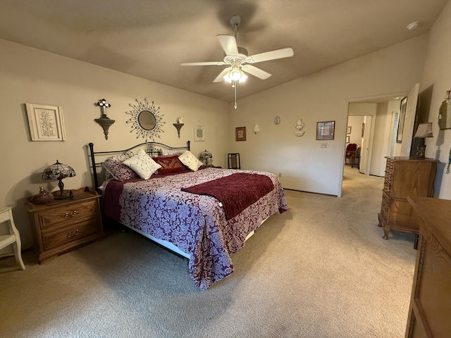 bedroom featuring lofted ceiling, ceiling fan, and light colored carpet