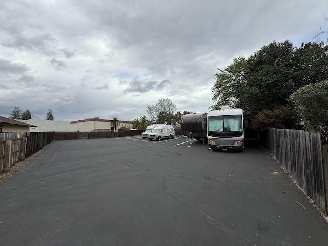 uncovered parking lot with fence