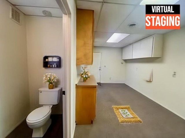 interior space with baseboards and visible vents