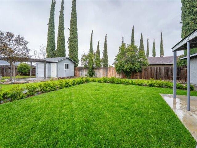 926 Cortina Dr, Orland, CA 95963 - view of yard with an outdoor structure and fence