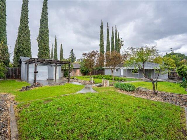 926 Cortina Dr, Orland, CA 95963 - view of yard with a fenced backyard and an outdoor structure