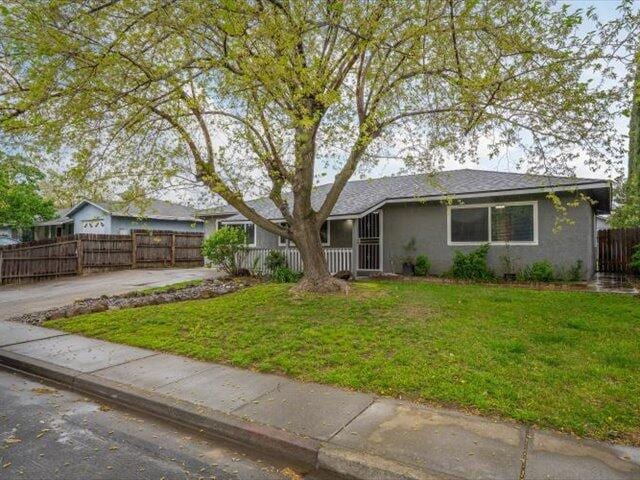 926 Cortina Dr, Orland, CA 95963 - single story home with a front lawn, stucco siding, fence, and concrete driveway