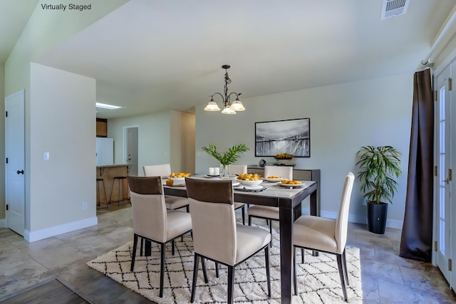 1680 Morningsun Dr, Redding, CA 96002 - dining area featuring baseboards and a chandelier