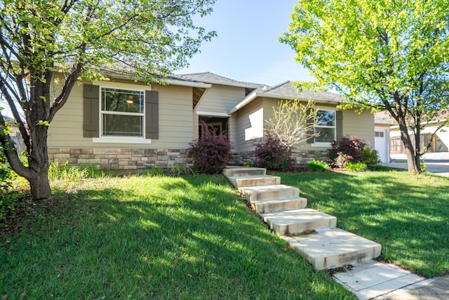 view of front of house with stone siding and a front yard
