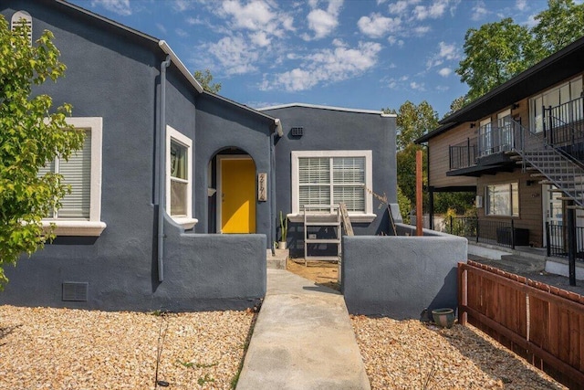 2176 Placer St, Redding, CA 96001 - exterior space with a balcony, stucco siding, and fence