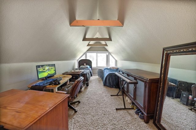 office area with carpet flooring and vaulted ceiling