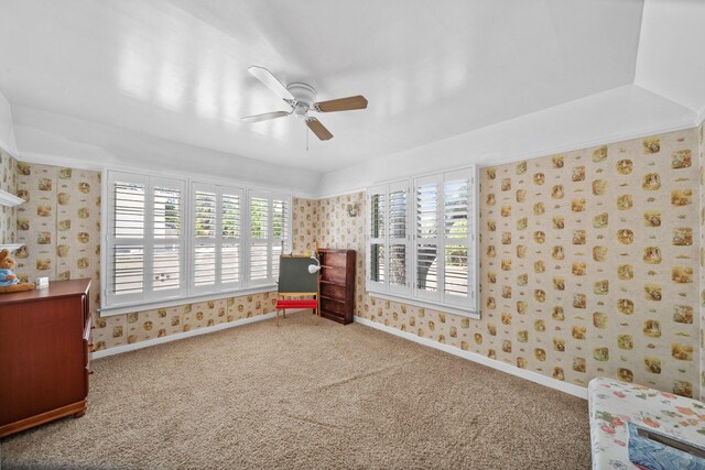 unfurnished bedroom featuring carpet flooring, wallpapered walls, and baseboards