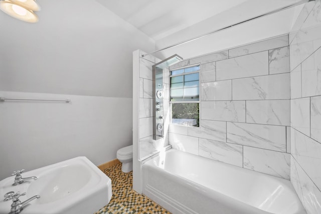 full bath with toilet, a sink, baseboards, and  shower combination