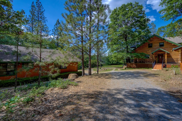 view of road featuring gravel driveway