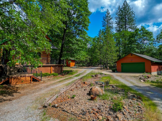 view of road with driveway and stairs
