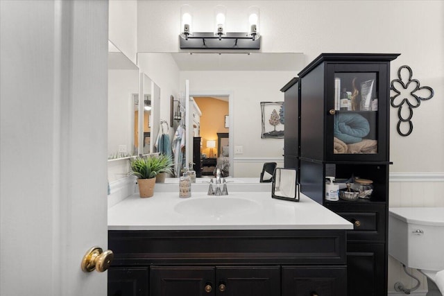 2919 Buckingham Dr, Shasta Lake, CA 96019 - bathroom with toilet, connected bathroom, and vanity