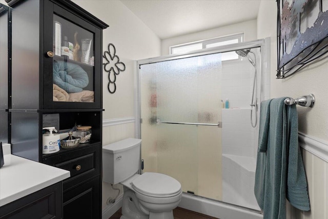 2919 Buckingham Dr, Shasta Lake, CA 96019 - full bathroom with toilet, wainscoting, and a stall shower
