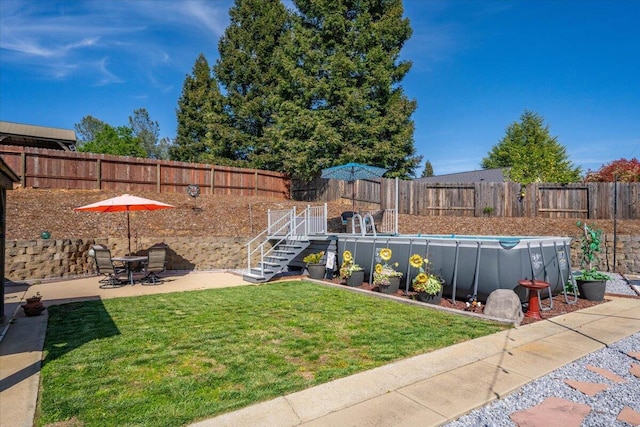 2919 Buckingham Dr, Shasta Lake, CA 96019 - view of yard featuring a patio area, a fenced backyard, and a fenced in pool
