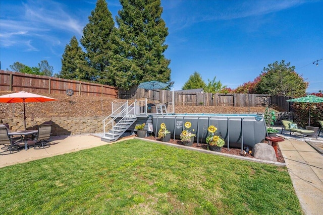 2919 Buckingham Dr, Shasta Lake, CA 96019 - view of yard featuring a patio, a fenced backyard, a fenced in pool, and stairway
