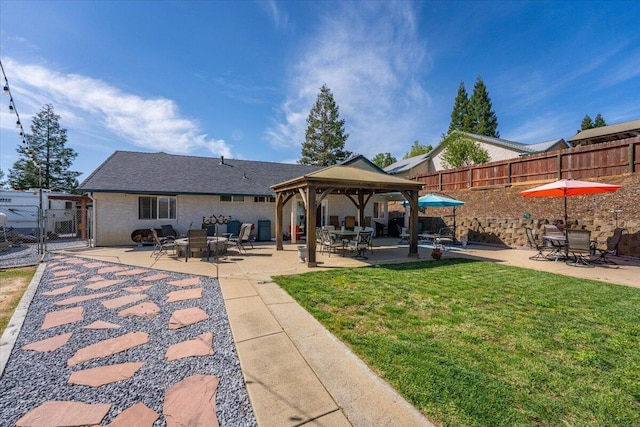 2919 Buckingham Dr, Shasta Lake, CA 96019 - rear view of property featuring a gazebo, a patio, fence, and a gate