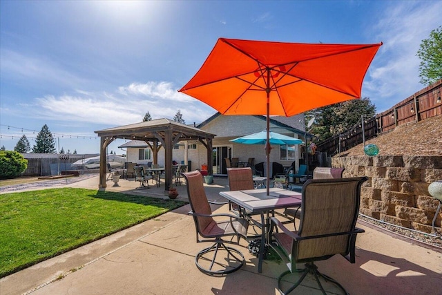 2919 Buckingham Dr, Shasta Lake, CA 96019 - view of patio with a fenced backyard, a gazebo, and outdoor dining area