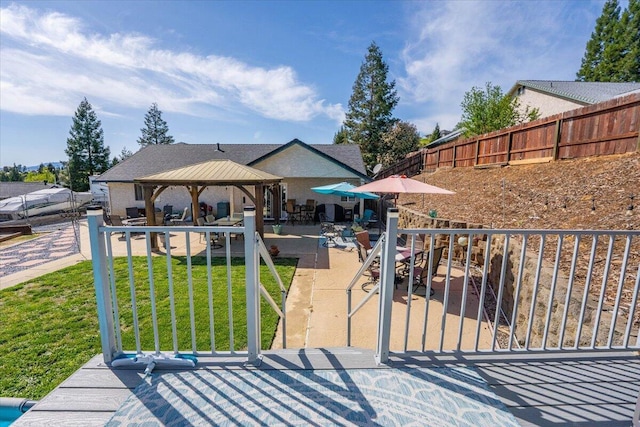2919 Buckingham Dr, Shasta Lake, CA 96019 - view of front of home with a gazebo, a patio area, a front yard, and fence