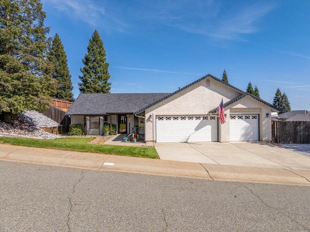 2919 Buckingham Dr, Shasta Lake, CA 96019 - ranch-style home featuring an attached garage, driveway, and fence