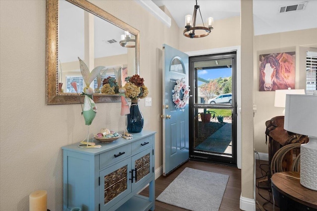 2919 Buckingham Dr, Shasta Lake, CA 96019 - entrance foyer with a chandelier, visible vents, baseboards, and dark wood finished floors