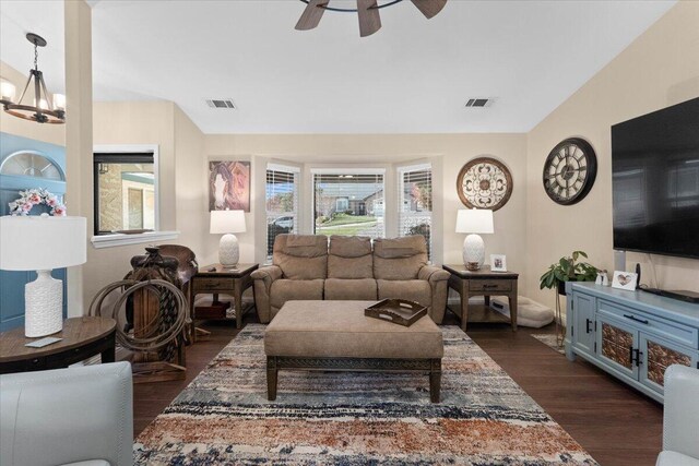2919 Buckingham Dr, Shasta Lake, CA 96019 - living room with dark wood-type flooring, ceiling fan with notable chandelier, and visible vents