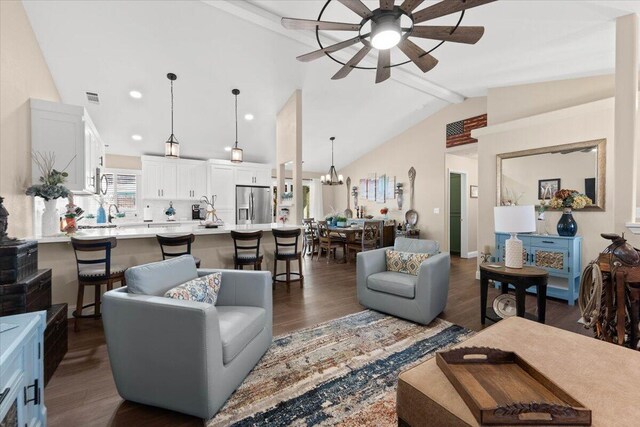 2919 Buckingham Dr, Shasta Lake, CA 96019 - living room featuring recessed lighting, visible vents, ceiling fan with notable chandelier, vaulted ceiling with beams, and wood finished floors