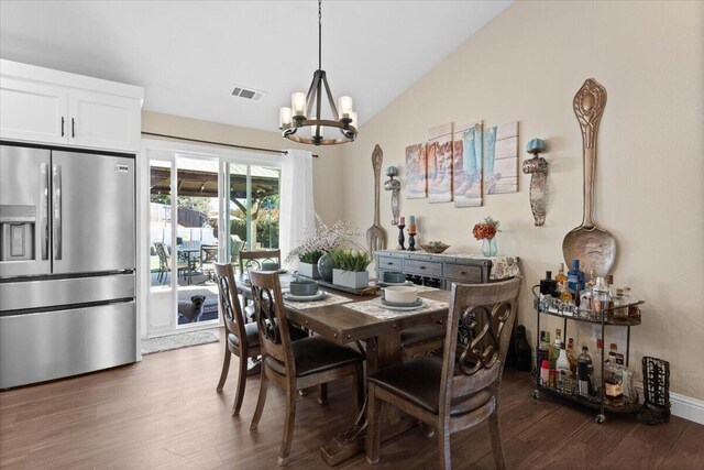 2919 Buckingham Dr, Shasta Lake, CA 96019 - dining space featuring visible vents, a notable chandelier, wood finished floors, and lofted ceiling