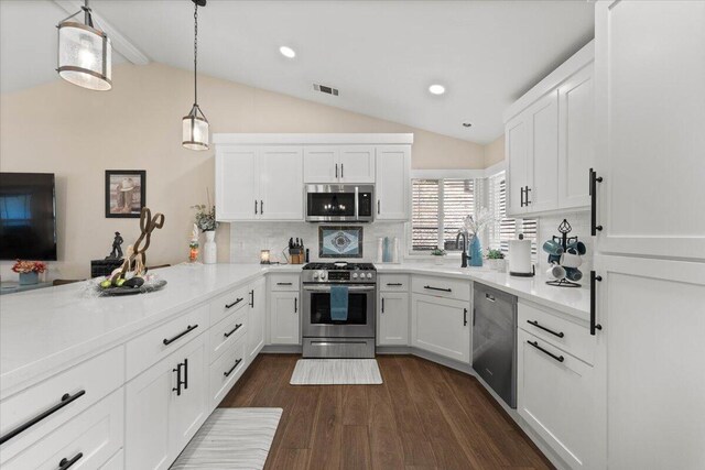 2919 Buckingham Dr, Shasta Lake, CA 96019 - kitchen with visible vents, decorative backsplash, appliances with stainless steel finishes, and lofted ceiling