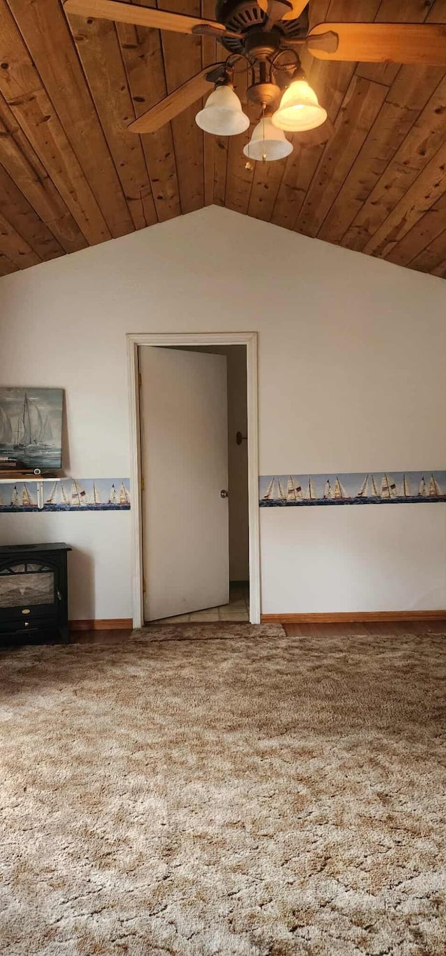 additional living space with carpet flooring, wooden ceiling, ceiling fan, baseboards, and lofted ceiling