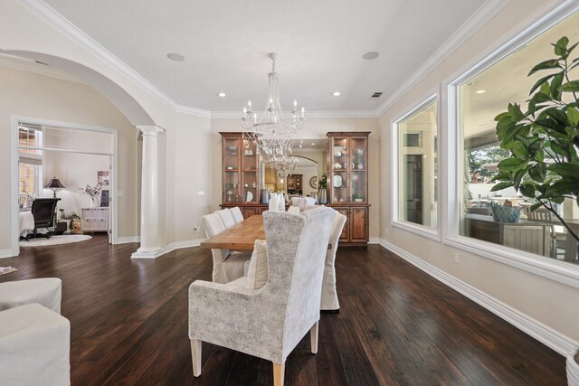 13194 Tierra Heights Rd, Redding, CA 96003 - dining room featuring dark wood-type flooring, arched walkways, a healthy amount of sunlight, and ornate columns