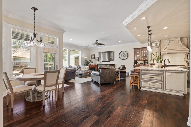 13194 Tierra Heights Rd, Redding, CA 96003 - living area with crown molding, ceiling fan with notable chandelier, recessed lighting, and dark wood finished floors