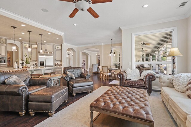 13194 Tierra Heights Rd, Redding, CA 96003 - living room featuring ceiling fan with notable chandelier, arched walkways, visible vents, recessed lighting, and wood finished floors